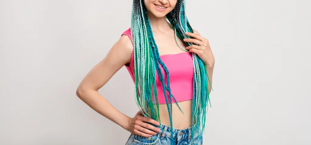 Woman with blue colored braids hairstyle