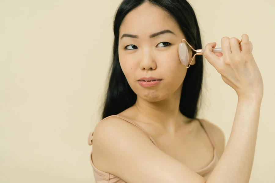 Woman giving herself facial massage