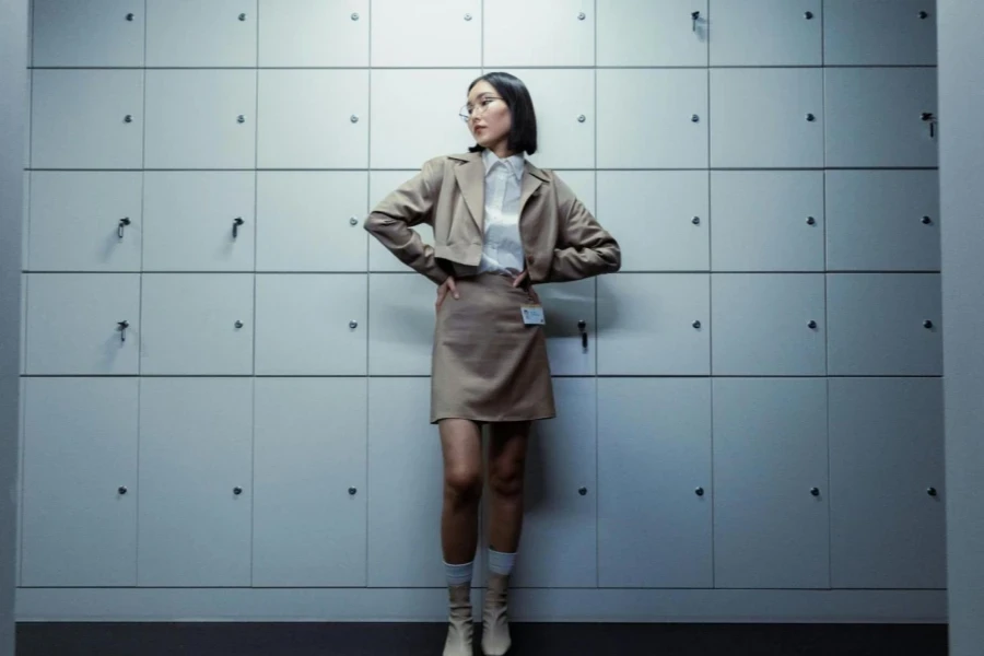 Woman in Beige Blazer and Skirt With Hands on Her Waist