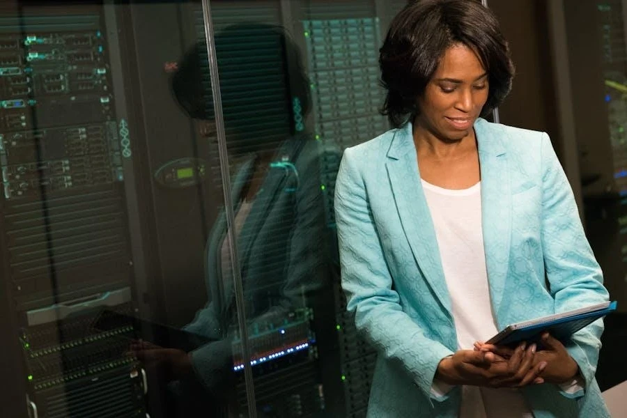 Woman standing next to servers