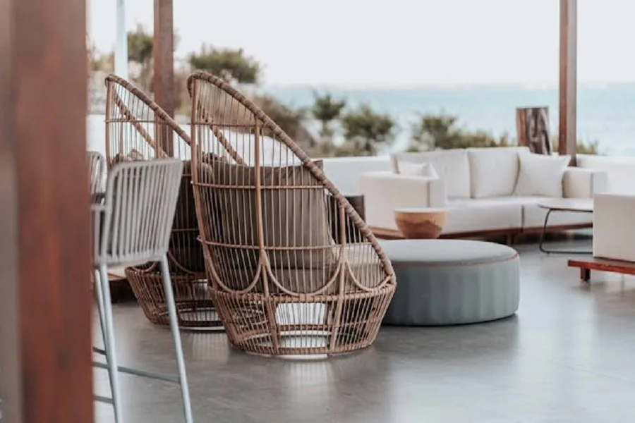 Woven club chairs and center tables on a terrace