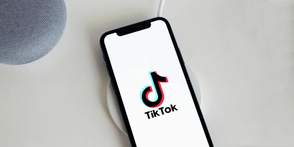 a cell phone with the TikTok logo on the screen