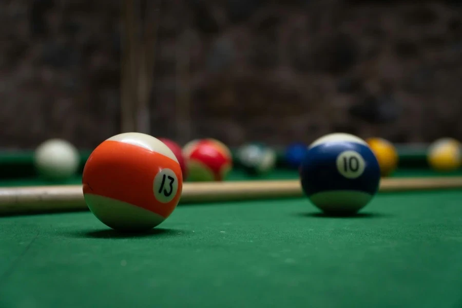 a pool table with several pool balls on it