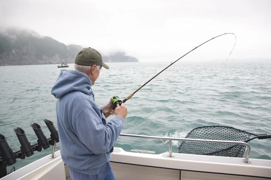 enior man fishing for salmon in Alaska