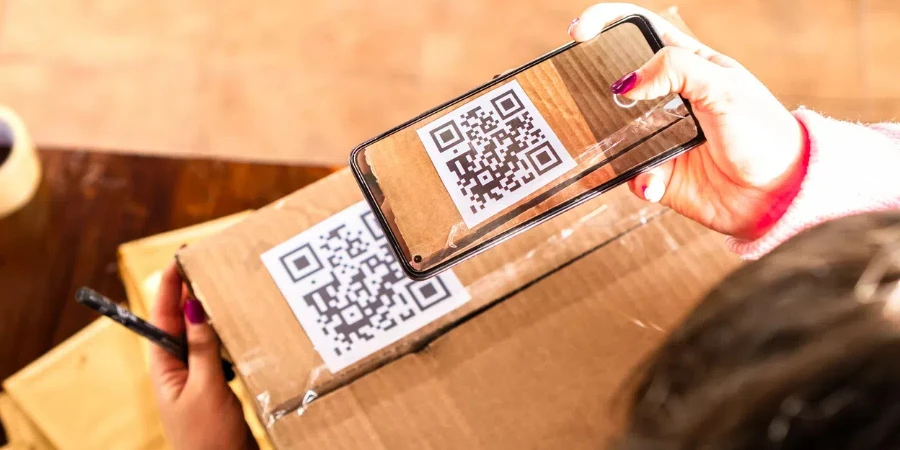 female scanning QR code on carton box