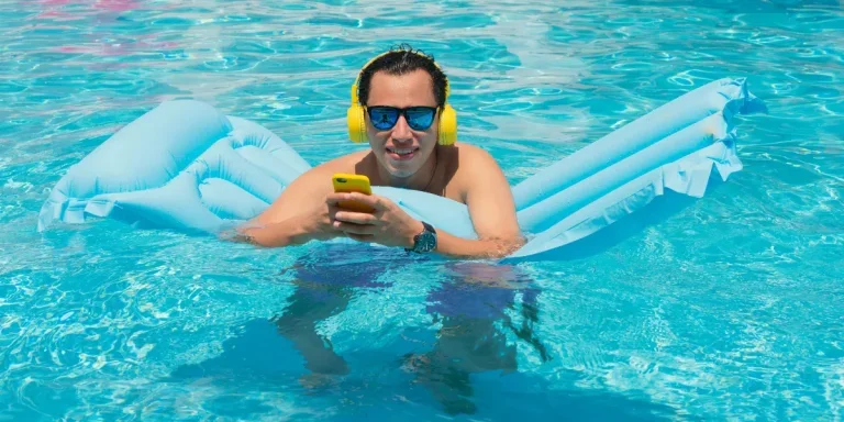 Man listening to music using swimming headphones