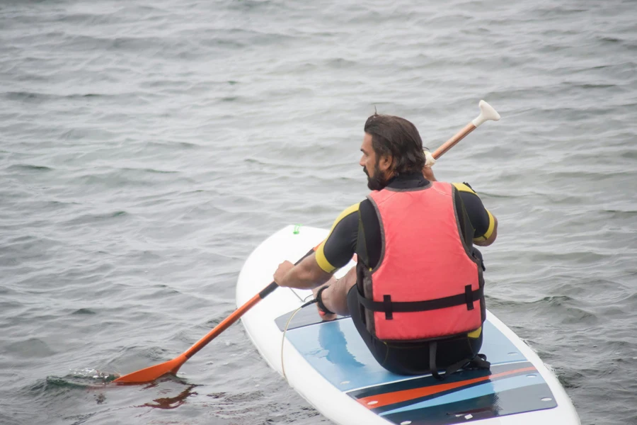 A Bearded Man Paddleboarding