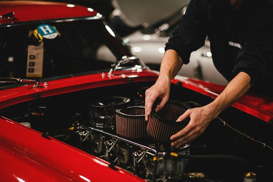 A Person Putting Air Filter in the Car