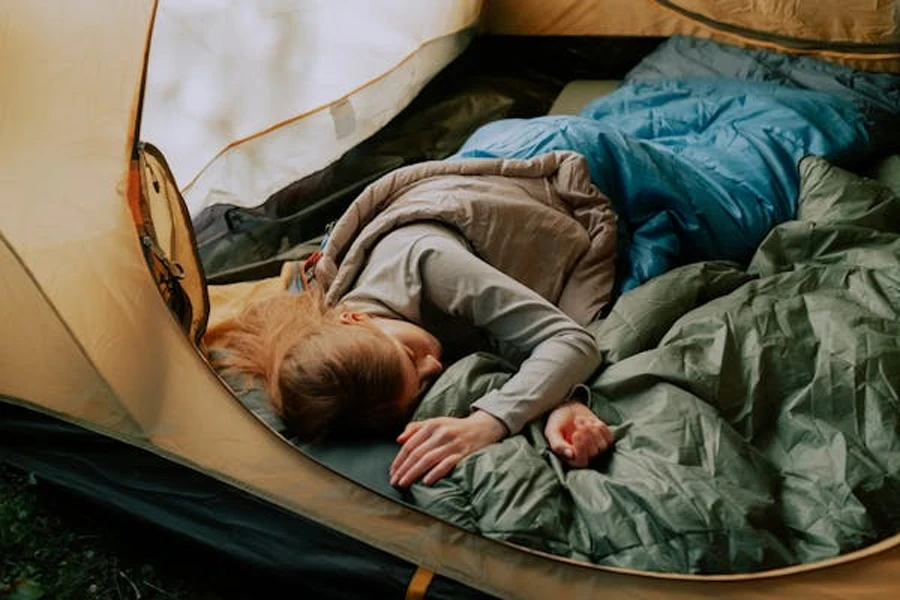 A Woman Sleeping in a Tent