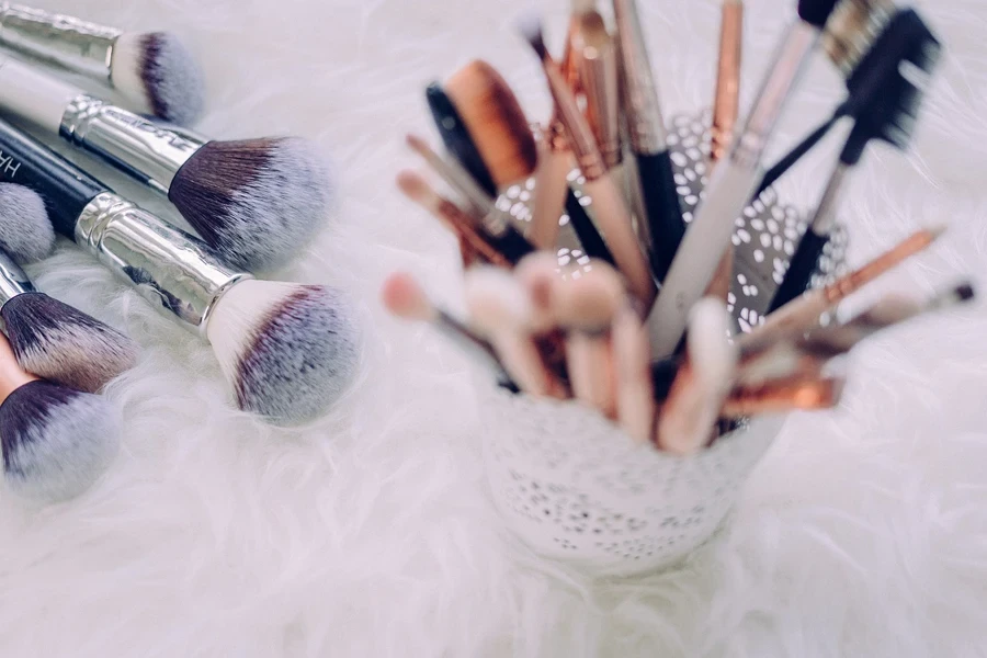 A few makeup brushes inside a holder