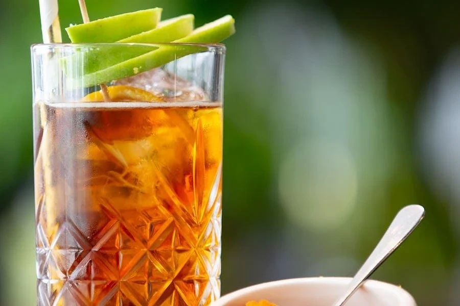 A highball glass with iced tea