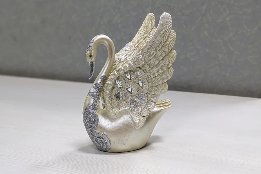 A highly decorated resin craft swan