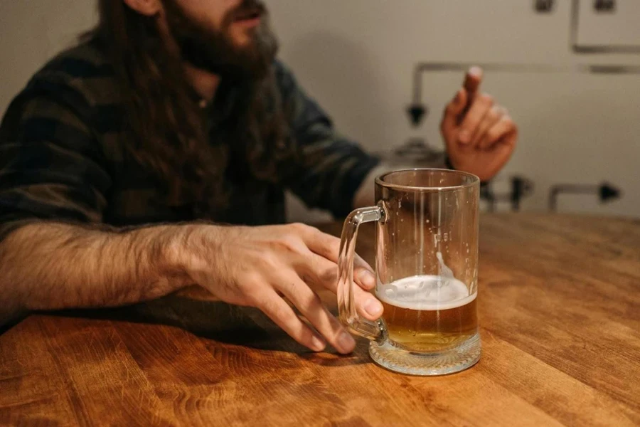 A man holding a beer glass