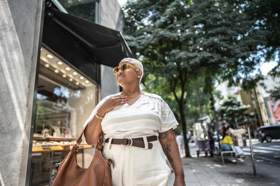 A mature plus-sized woman in a stylish outfit