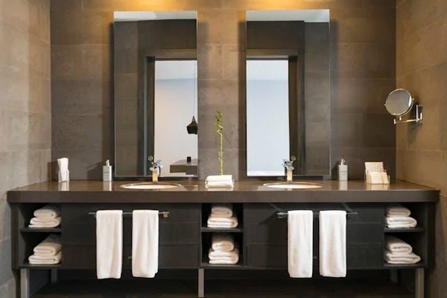 A neatly arranged bathroom counter with clean towels