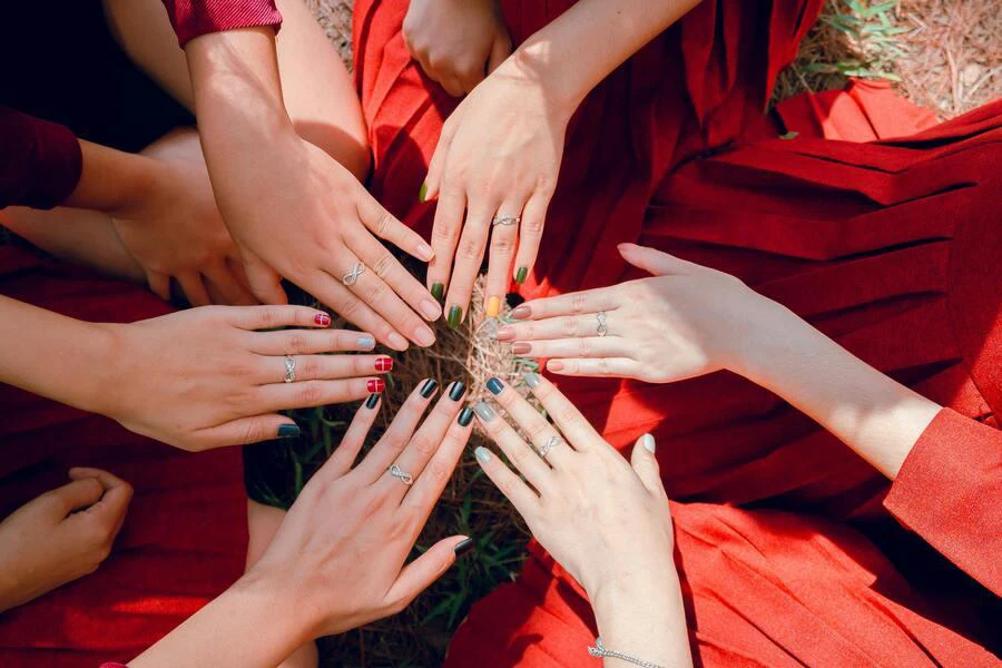 A photo of women’s manicured hands