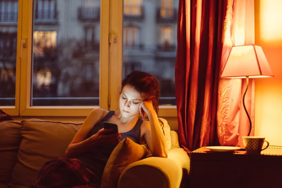 A serious-looking woman on her phone