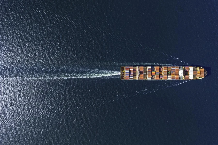 Aerial top view container ship in export and import business and logistics