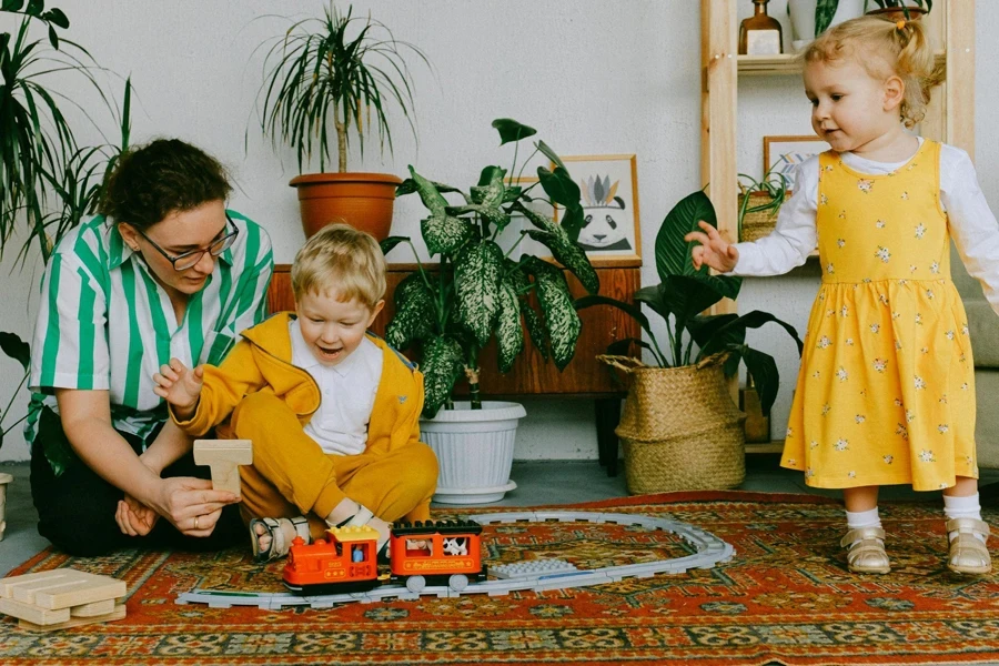 Babies Playing Toy Cars with Their Mother