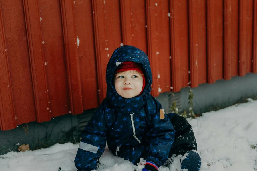 Boy Playing with Snow