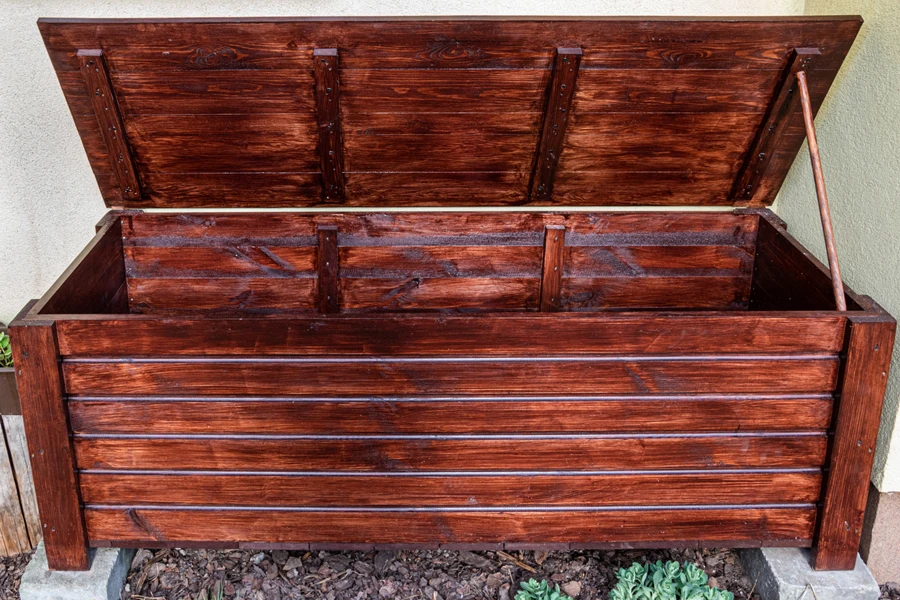 Brown outdoor gallon bench placed in a garden