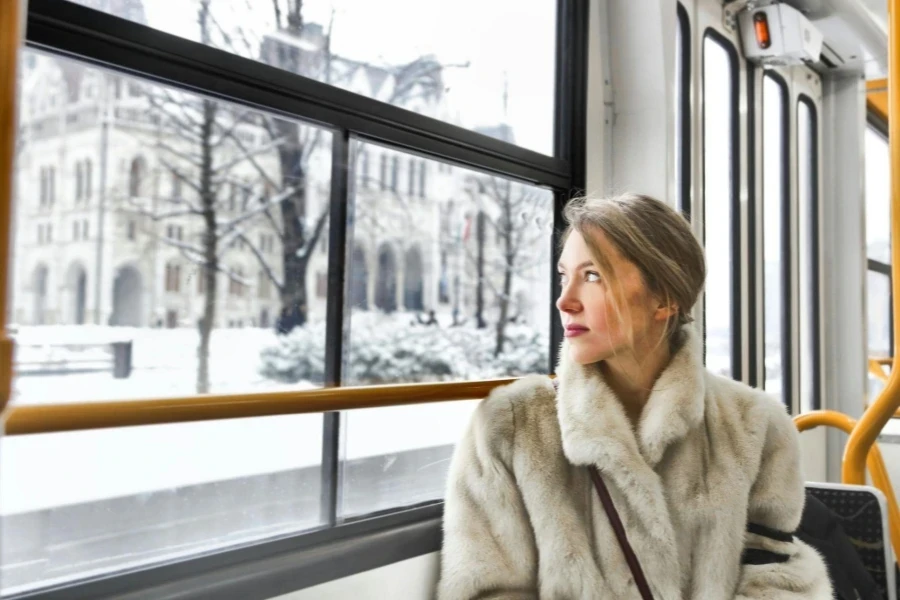 Cam Young Woman in Warm Clothes in Public Transport