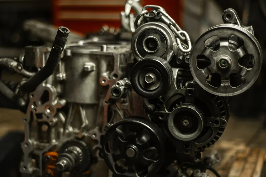 Car engine pulleys in a repair shop