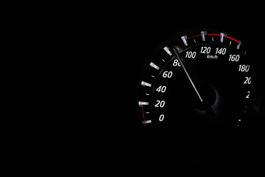 Close Up of a speedometer Against Black Background