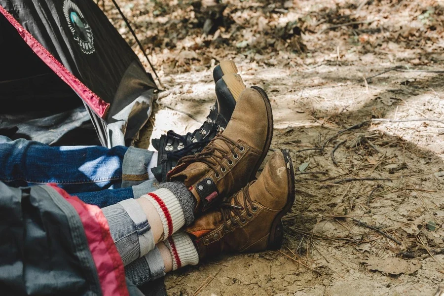 Couple Relax On Camping Trip In Tent