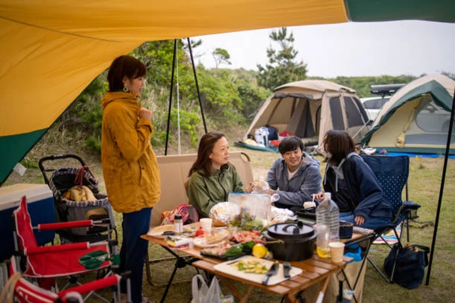 Families Eating Foods and Talking at Camp