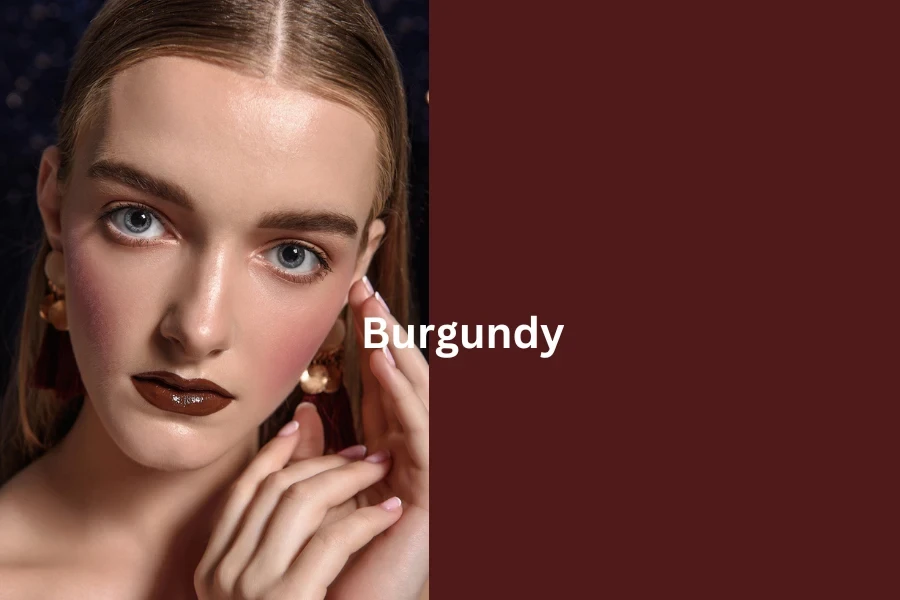 Fashionable girl with bright, professional evening make-up. Burgundy lipstick, clean, natural face, French manicure.