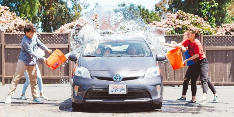 Four Children Washing Silver Toyota Prius