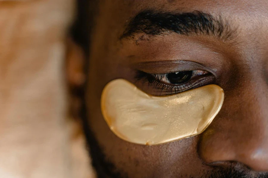 Gold under-eye patches on black men