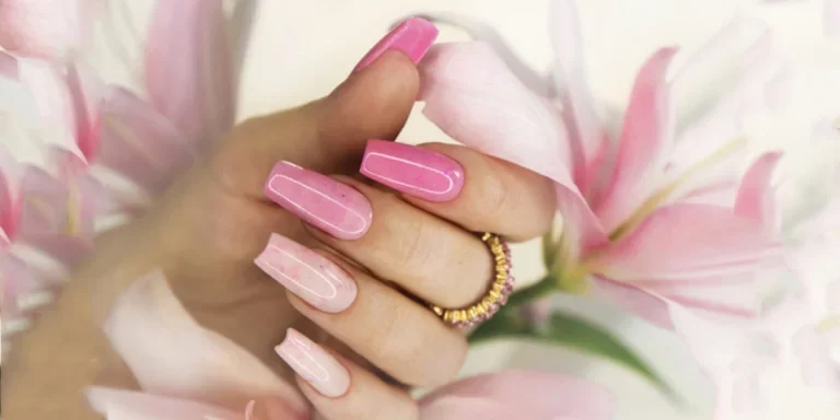 Hand with pink acrylic nails