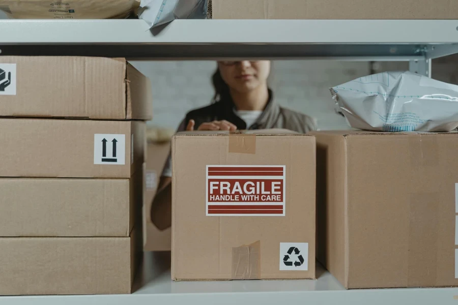 Lady checking sorting packaged goods in a store