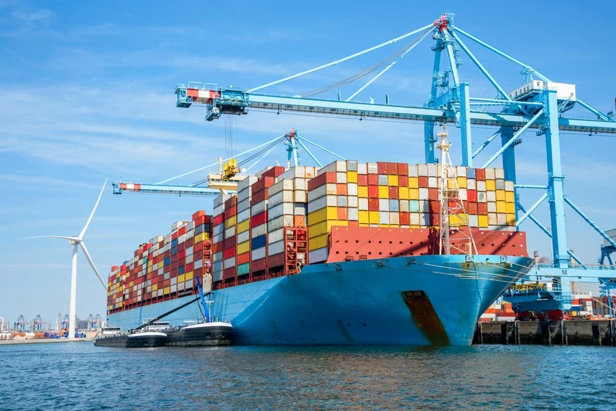 Large container ship in harbour on a clear summer day