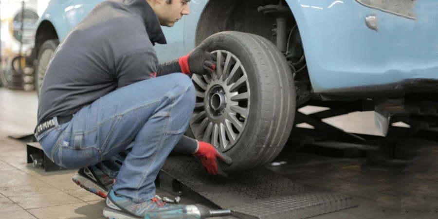 Man Changing a Car Tire