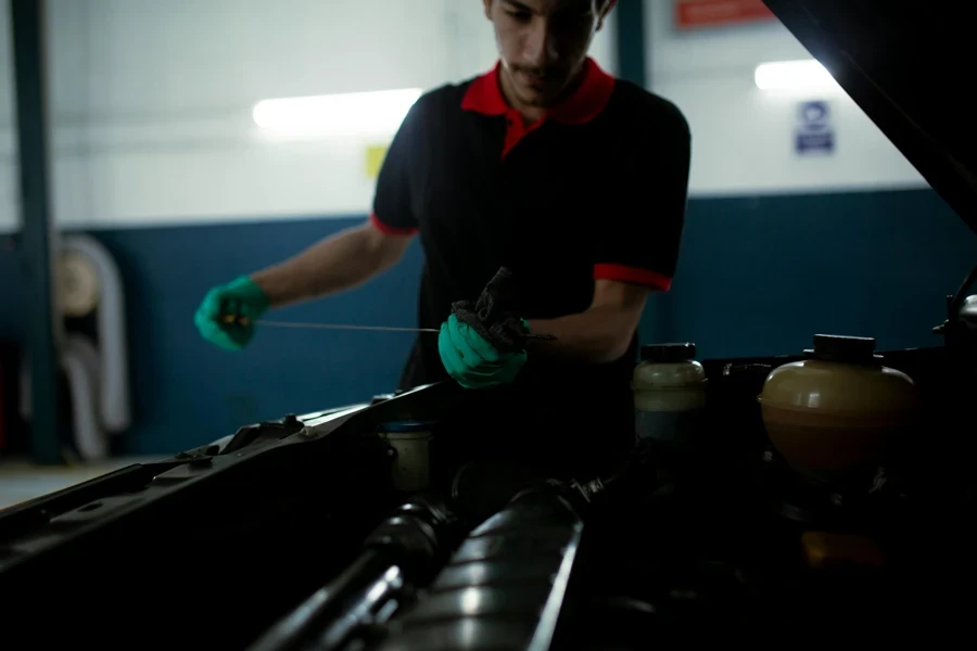 Man Checking the Engine Oil