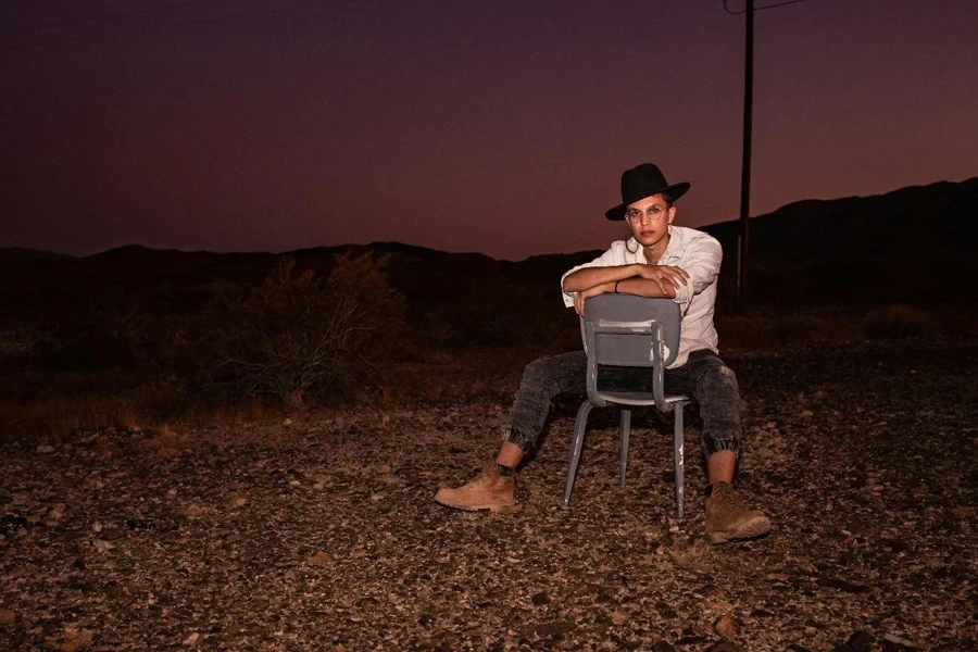 Man Sitting Backward on Chair