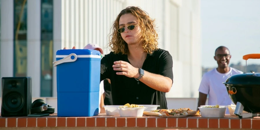 Man Wearing a Black Shirt and Sunglasses