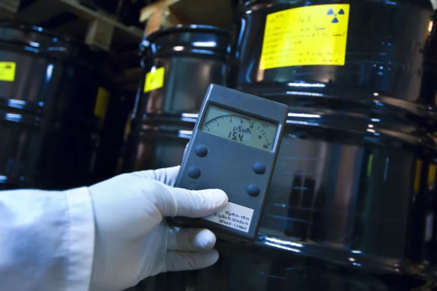 Man checking radiation with Geiger counter