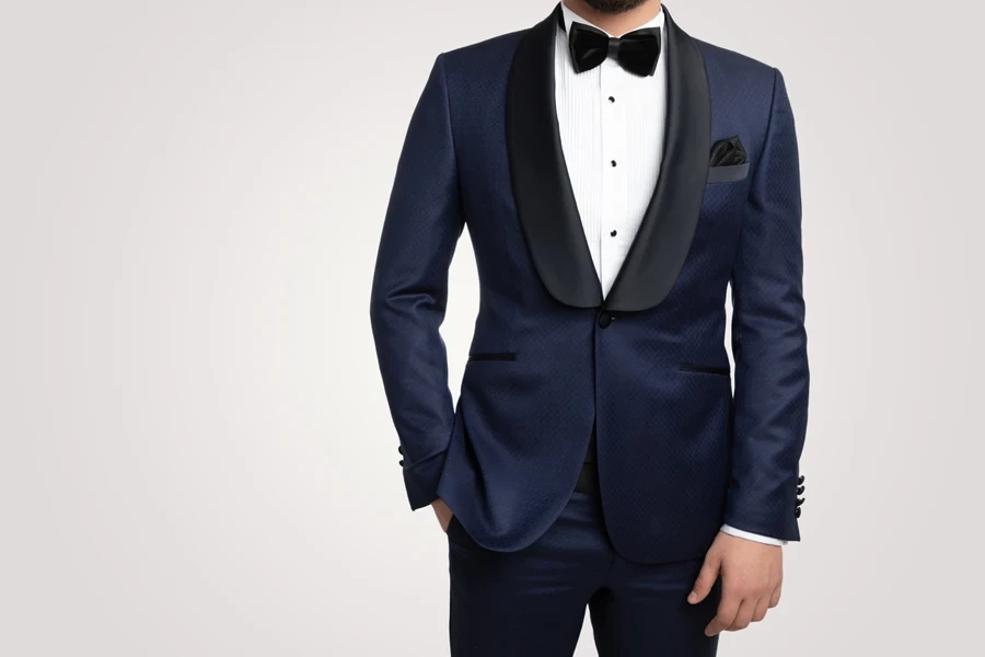 Man in a deep blue tuxedo with black detail