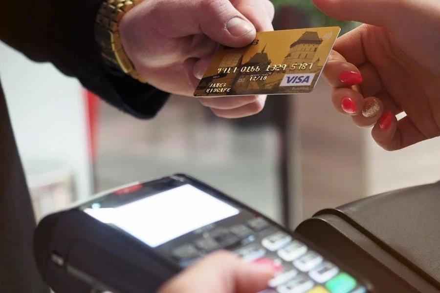 Man making EFT payments with a Visa card