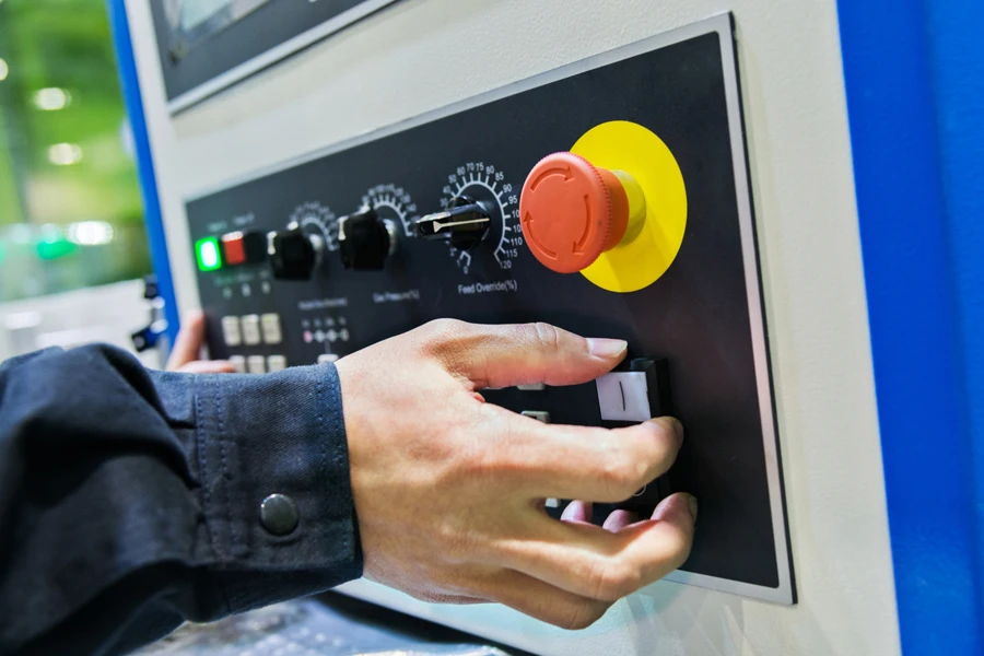 Man operating a programmable control machine