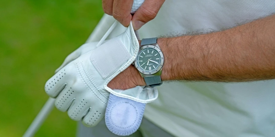 Man putting on a Golf Glove