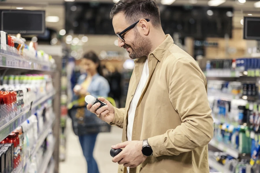 Man shopping for roll-on deodorants