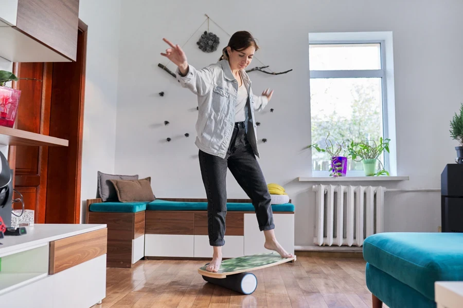 Middle-aged woman on fitness balance board