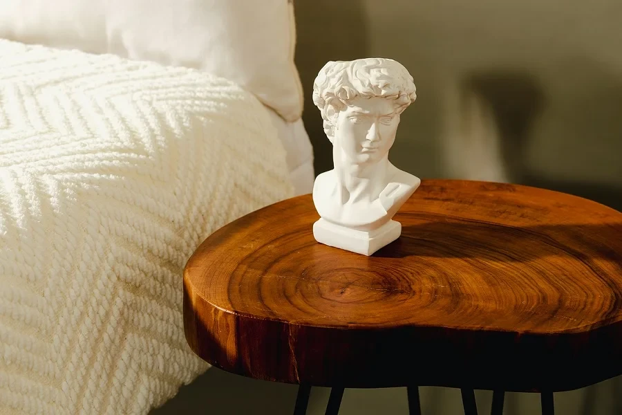 Molded plaster bust of a man on a bedside table