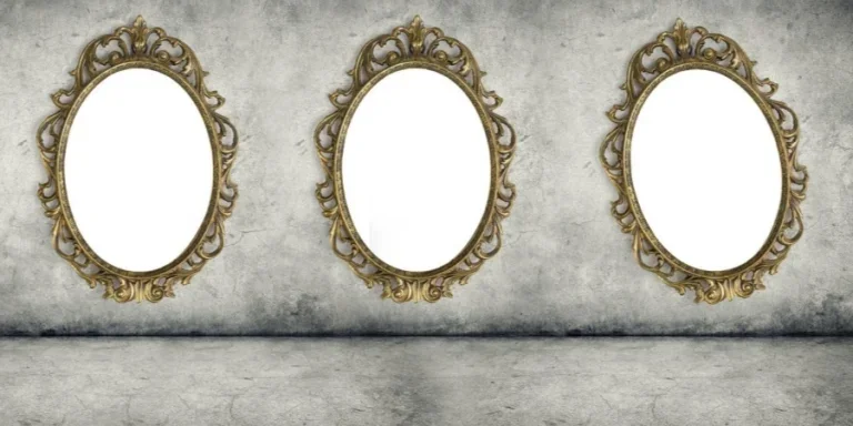 Ornate golden frames hanging on the concrete wall