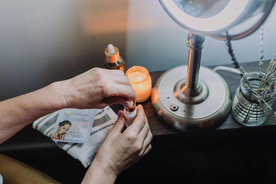 Person Holding Orange and Silver Hand Tool